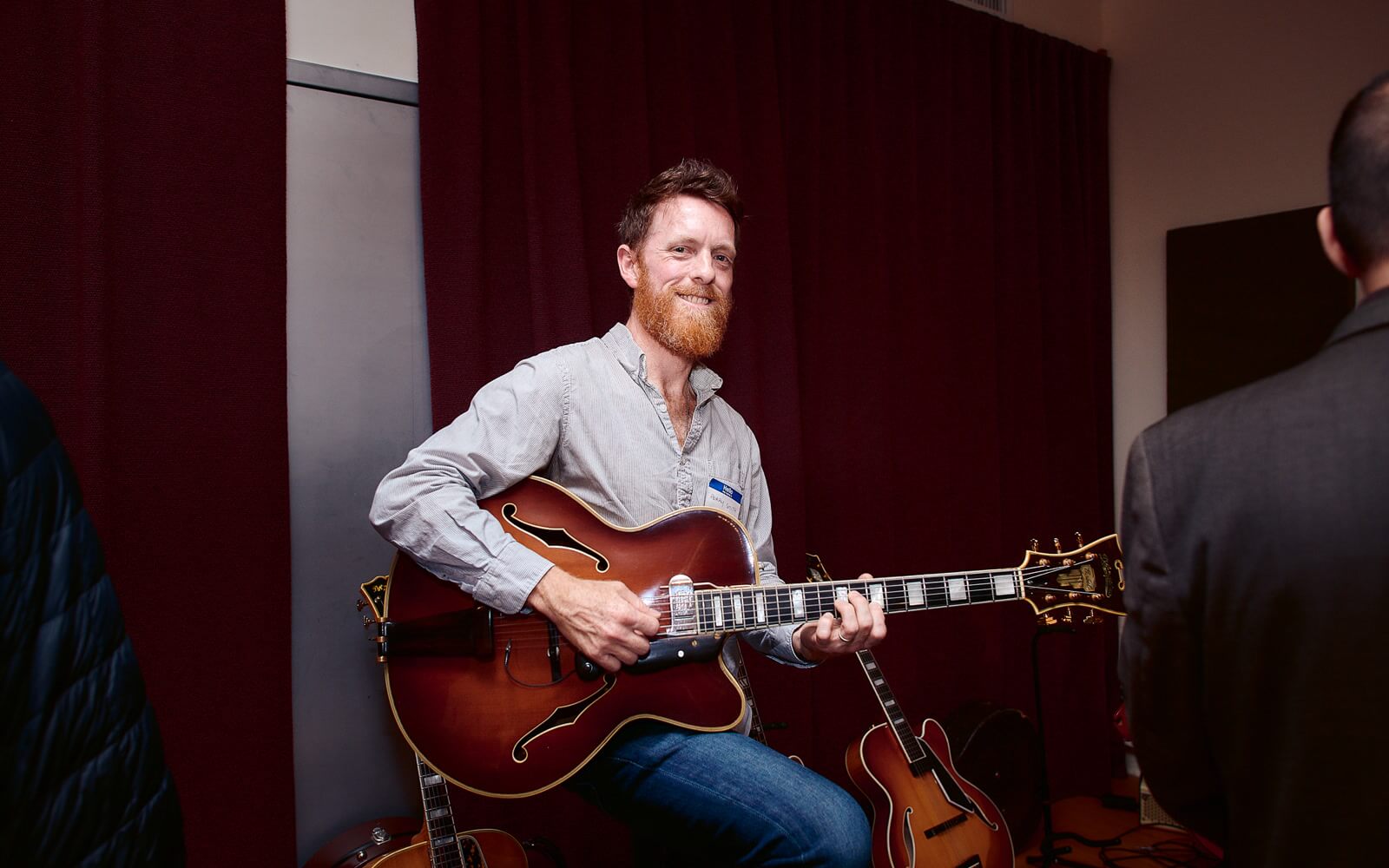 A guitarist holding the Chuck Wayne 1949 D'Angelico Excel at Brooklyn Guitar Feast I.