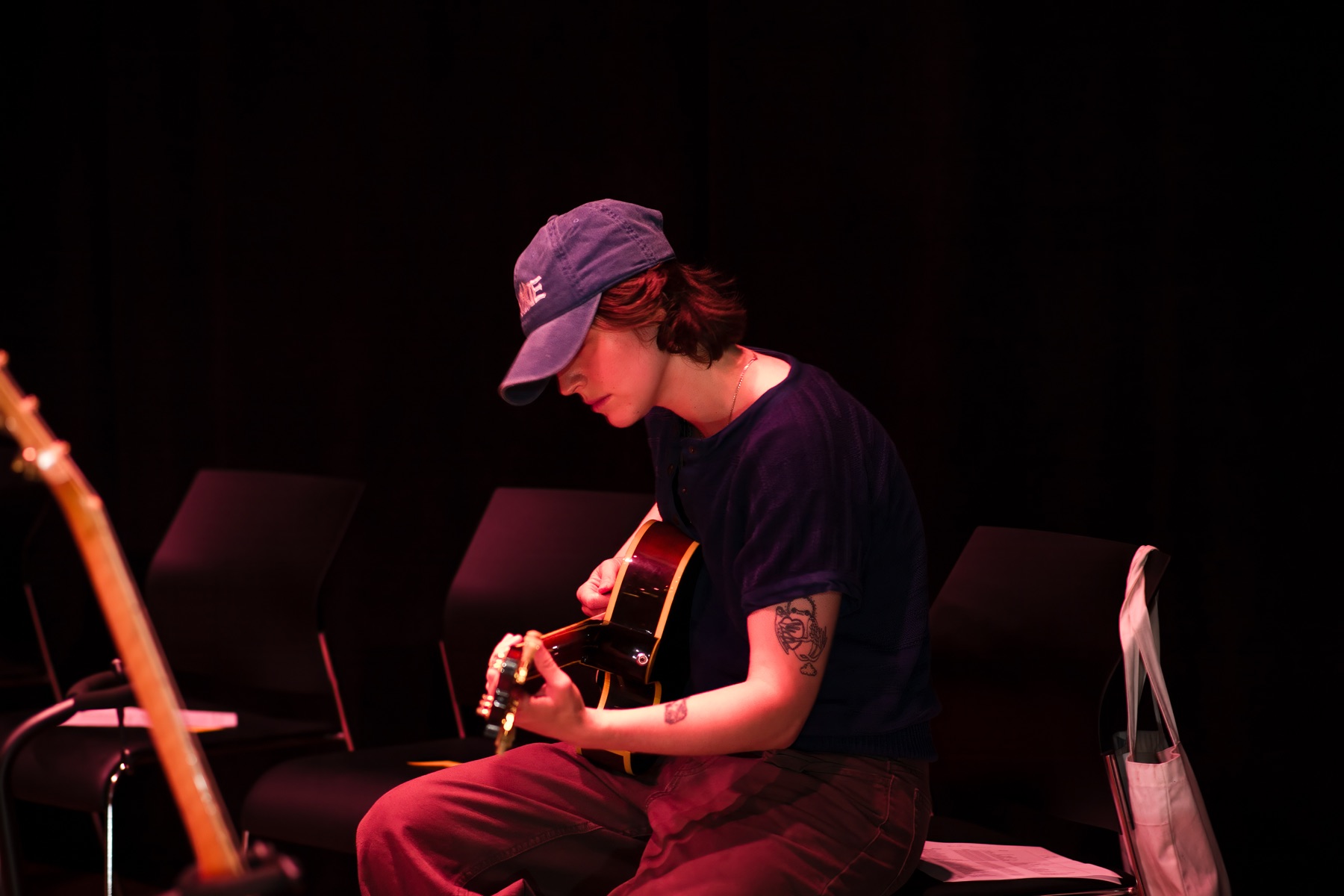 Hank Heaven studying guitar options at Brooklyn Guitar Feast II.