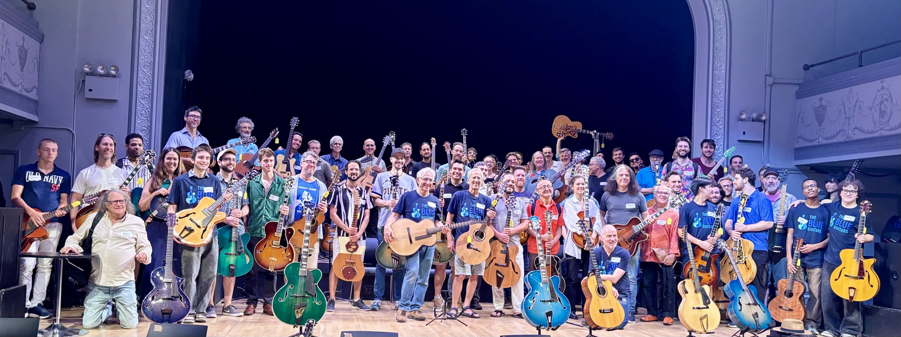 The Brooklyn Guitar Feast III group gathered onstage with guitars at Roulette.