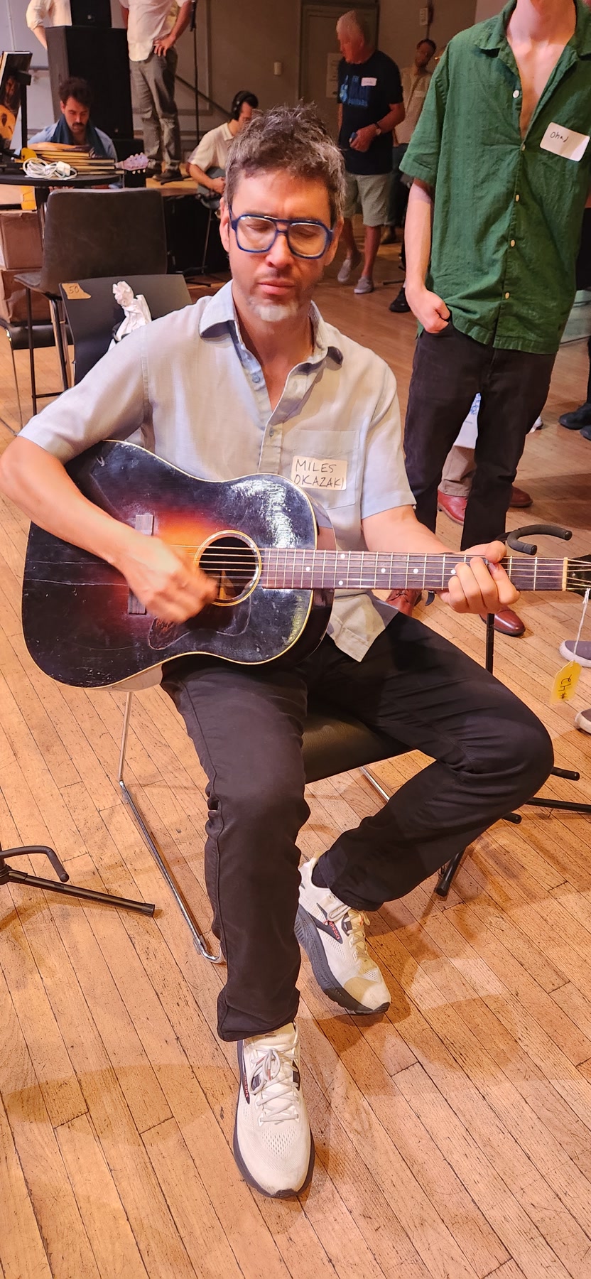 Miles Okazaki playing a vintage acoustic guitar at Brooklyn Guitar Feast III.
