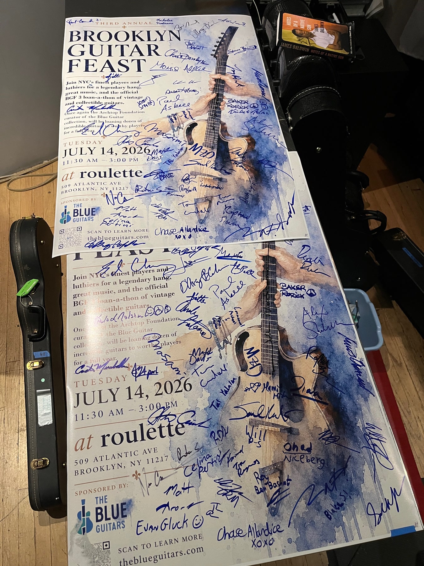 Two Brooklyn Guitar Feast III posters covered with attendees’ signatures.