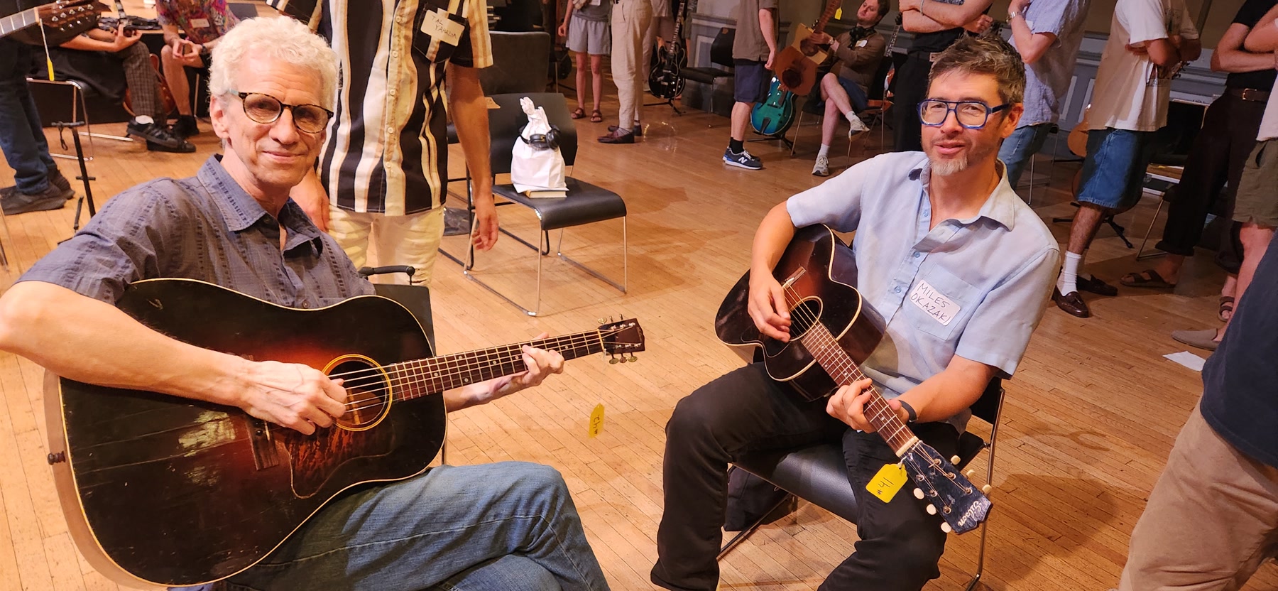 Two guitarists playing vintage acoustic guitars together at Brooklyn Guitar Feast III.